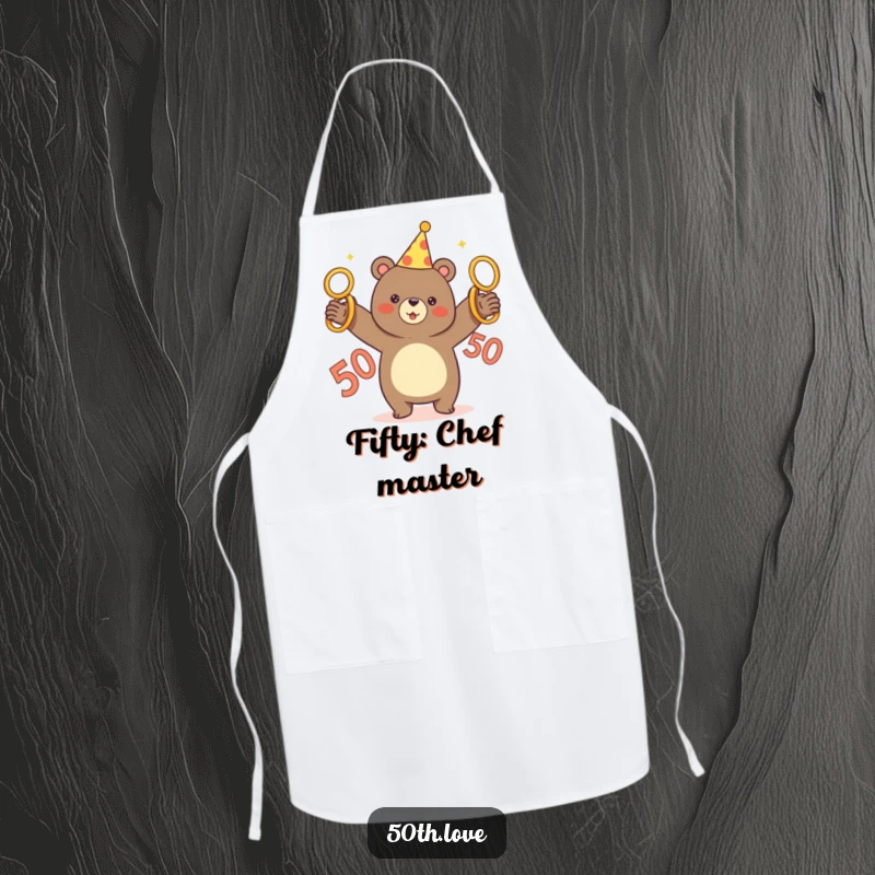 Funny chef apron featuring a bear in a party hat juggling five golden rings, marking a 50th birthday celebration.