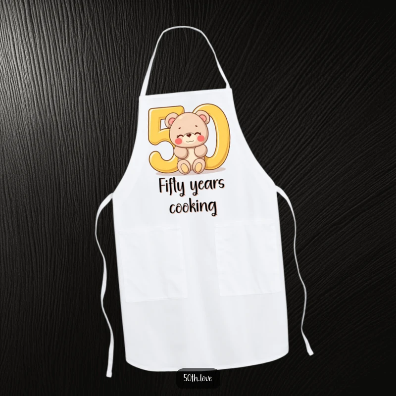 Funny '50th Birthday Bear' Apron: A plush bear winks from a giant golden number 50, ready for a birthday celebration in the kitchen.