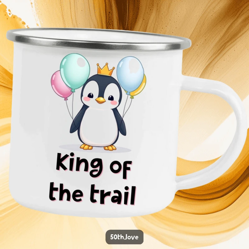 Funny penguin with a crown examines balloons on a sturdy camping mug, for royal birthday sips outdoors.