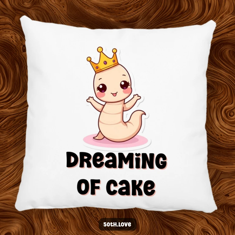 Funny birthday pillow featuring a crowned worm dancing around a cake, offering humorous comfort and royal charm.