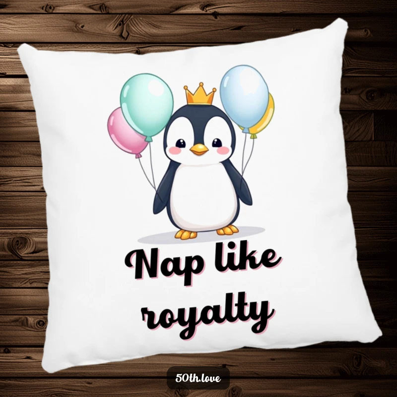 Funny penguin with a crown curiously examining balloons, on a soft pillow, offering a touch of regal and cozy birthday fun.