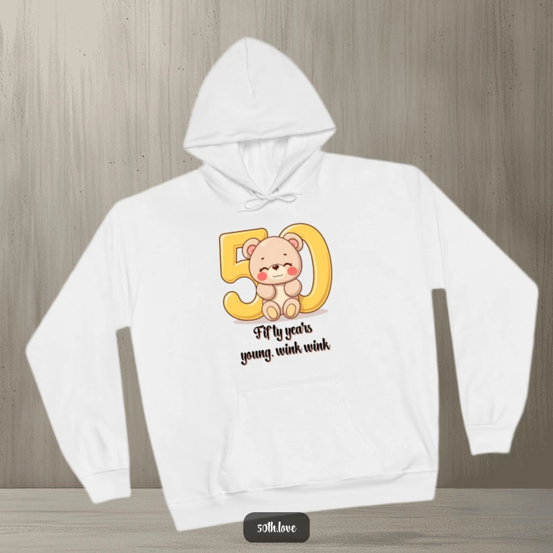 Funny '50th Birthday Bear' Hoodie: A plush bear winks playfully from inside a giant golden number 50, ideal for a cozy celebration.