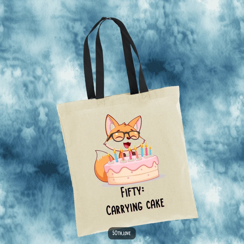 Funny tote bag with a giggling fox in glasses blowing out candles on a big birthday cake.